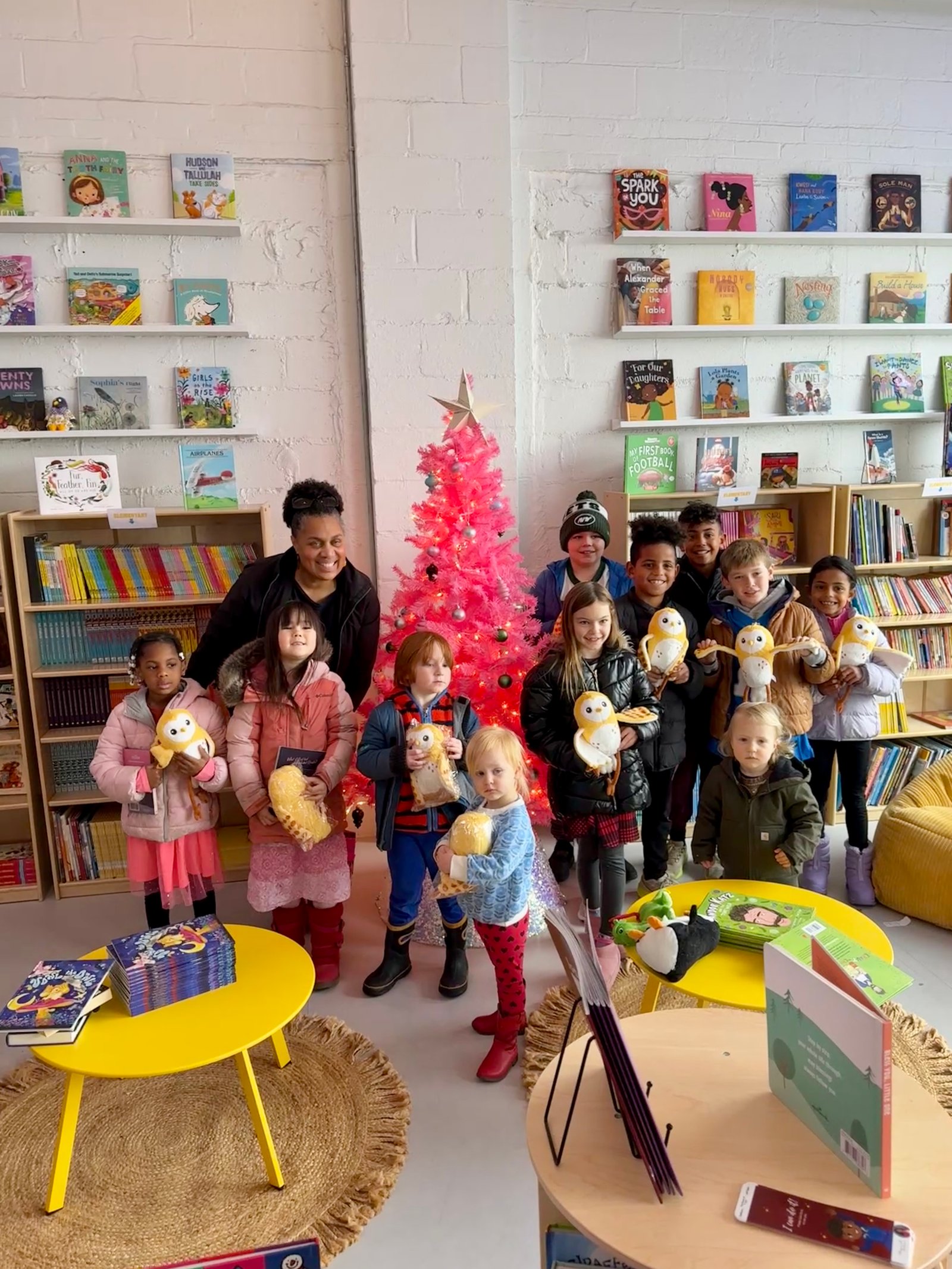 Children holding Vowl plushies at Birdie's Bookmobile